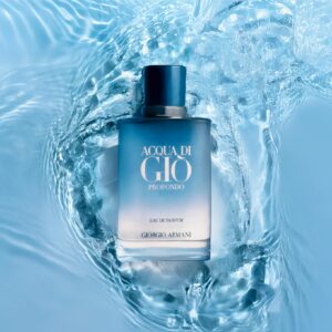 A stylish perfume bottle submerged in calming blue water, evoking freshness and elegance.